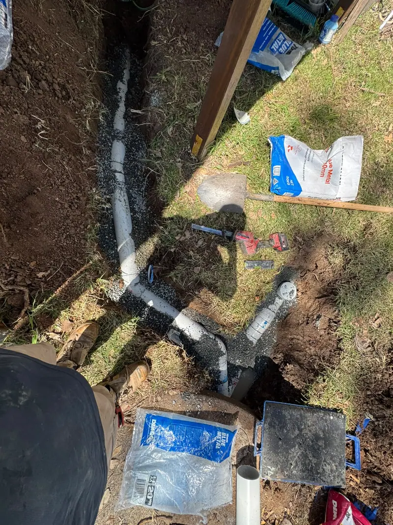 Exposed drainage junctions and pipework laid in bedding