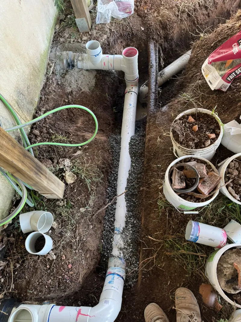 Replacement drainage pipe with accessible junctions before backfilling