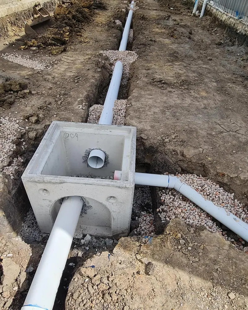 New stormwater pit connected to drainage pipes in prepared bedding